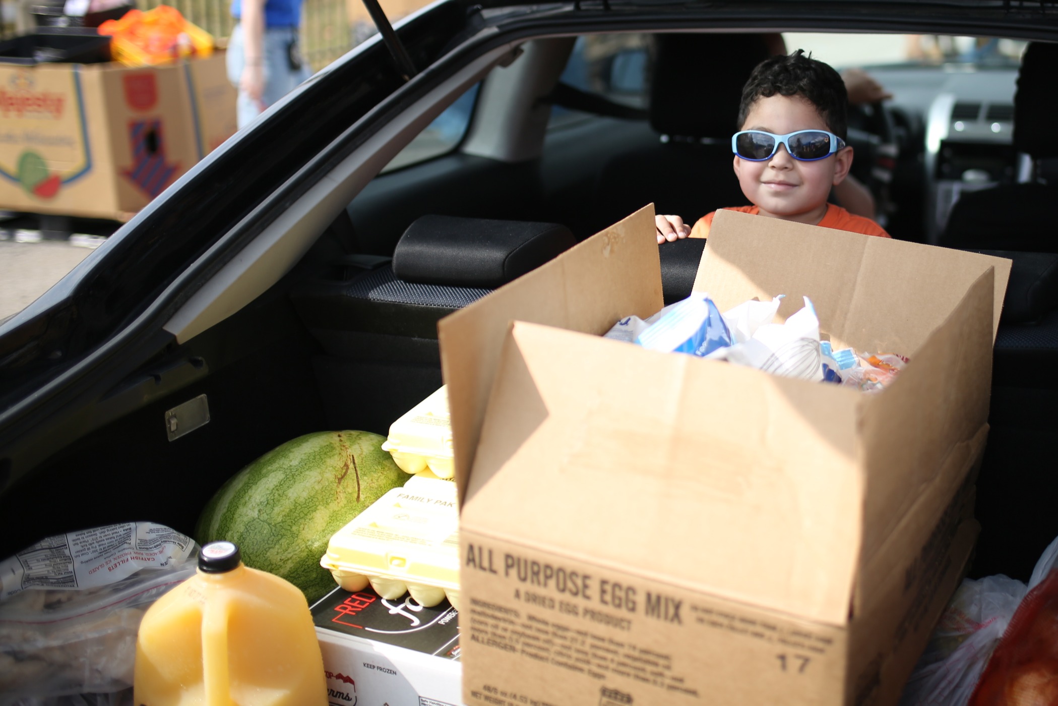 Family receiving free food at a Mobile Food Distribution event.